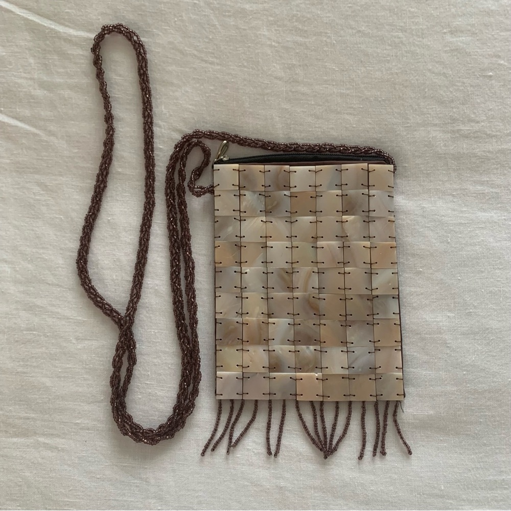 Crossbody bag, stylish bag, NWOT, Beaded strap and beaded fringe, satin back.